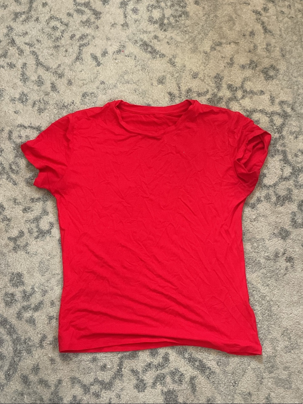 Tight red shirt, size medium.